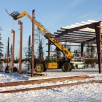 Pre-fabricated steel building being erected