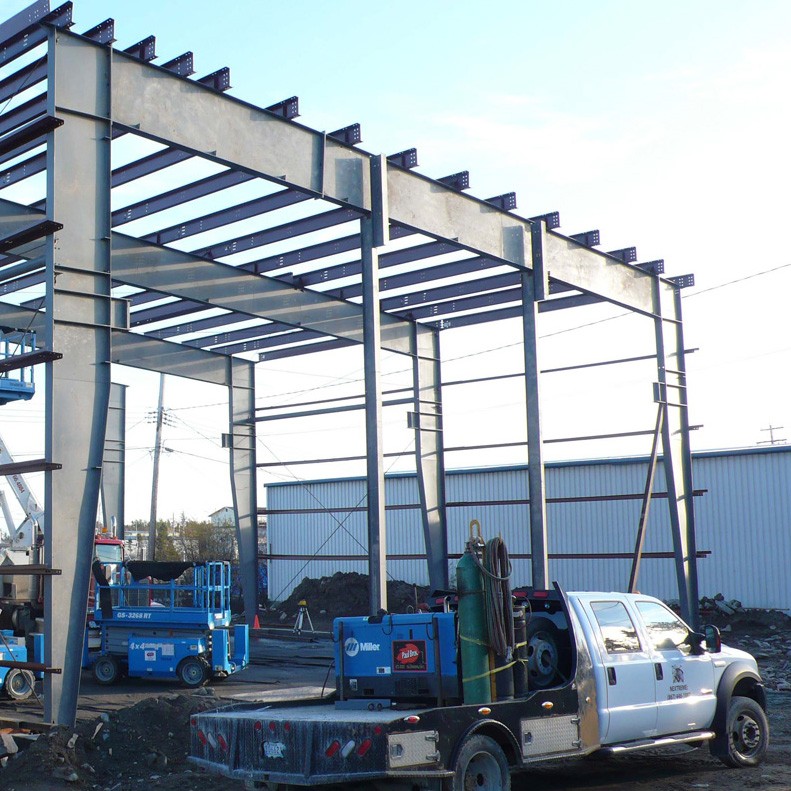 Pre-Fabricated steel building being assembled