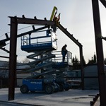 Roof joists being raised for a steel building